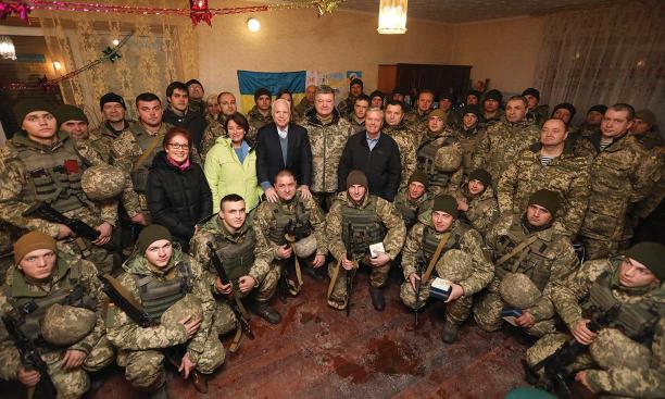 Photo of Yovanovitch and three U.S. senators posing with Ukrainian soldiers and Petro Poroshenko, then the president of Ukraine, in the Donetsk region in 2016.