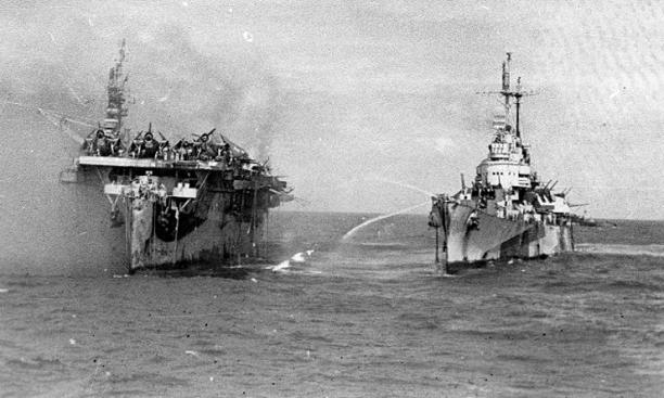 1944 - The USS Princeton afire (left) and the USS Birmingham: On the sea.