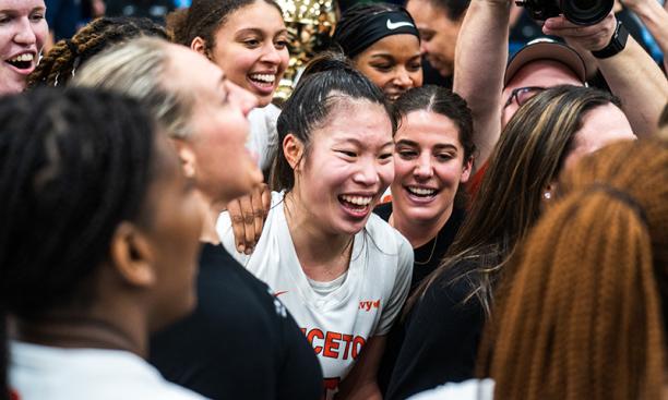 Kaitlyn Chen ’24 celebrates with her coaches and teammates.