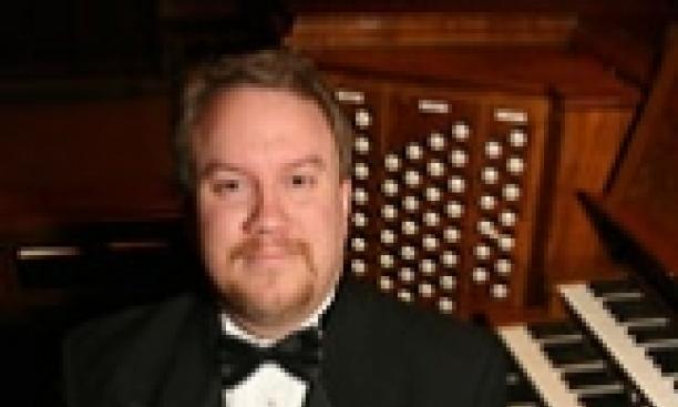 Eric Plutz at the keyboard of the Chapel organ.