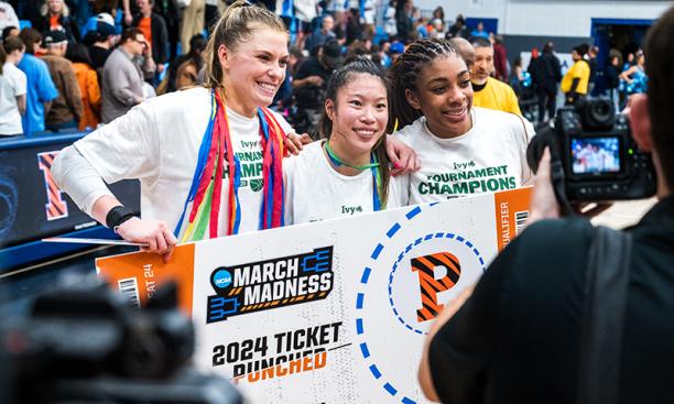 Three players with "ticket punched" sign