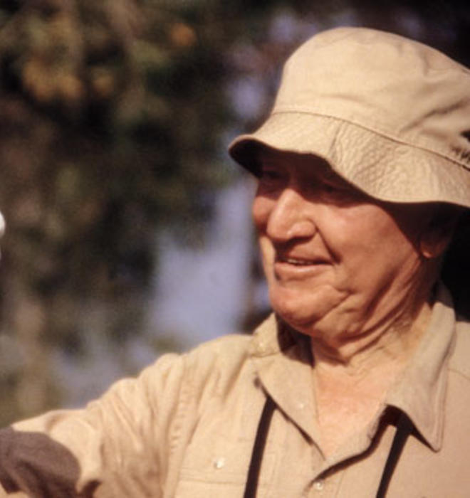 Train meets a white parrot in August 1994, when he was with the World Wildlife Fund.