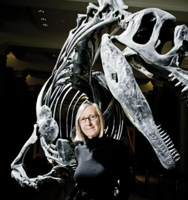 Gerta Keller in the atrium of Guyot Hall, with an Antrodemus dinosaur excavated during a 1941 dig.