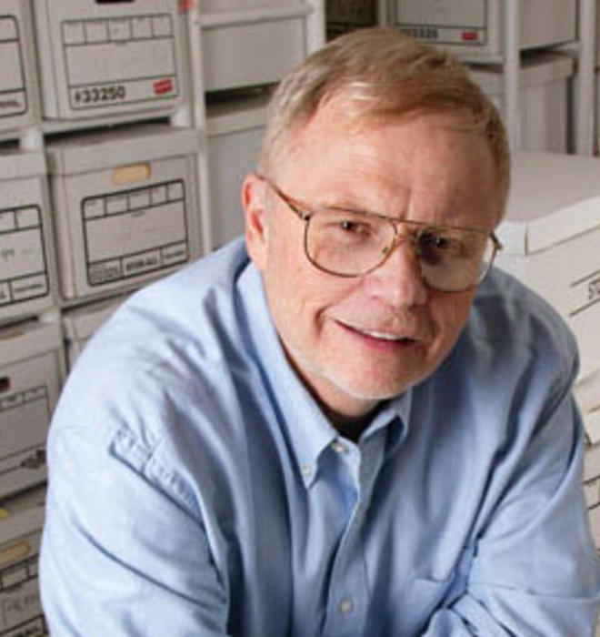 Jeff Perry ’68 in the basement of his home, surrounded by files to be used in his future writing projects.