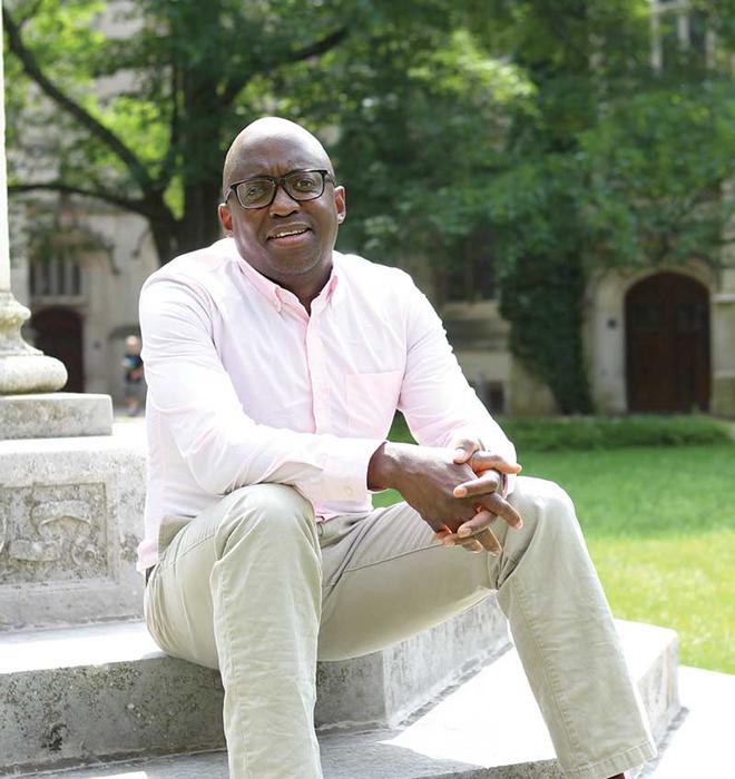 Jacob Dlamini sitting on steps on Princeton's campus.