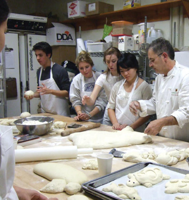 From left, Joseph Vellone ’10, Katy Andersen ’08, Arianna Gianola ’09, Yuanbo Liu ’10, and Emily Forscher ’10 learn how to make baguettes and ciabatta with Witherspoon Bread Company master baker Denis Granarolo last year.