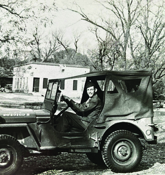 Ernest Stock ’49 driving a Jeep