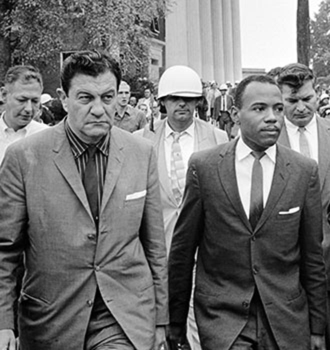 John Doar ’44, right, escorts James Meredith at the University of Mississippi in 1962.