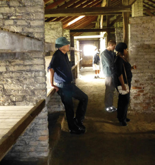 Students visit Birkenau, part of the Nazis’ Auschwitz concentration camp. From left, professor Jan Gross, Eric Silberman ’13, and Lydia Demissachew ’15 examine the barracks where Jewish prisoners were housed. 