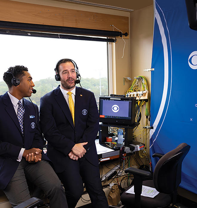 Ross Tucker ’01, right, makes one of his many broadcasting stops this fall, calling the Army-Boston College game in West Point, New York.