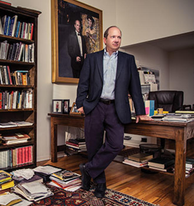E. Randol Schoenberg ’88 at home in Los Angeles. The large framed picture is a portrait of him with the painting he helped retrieve.
