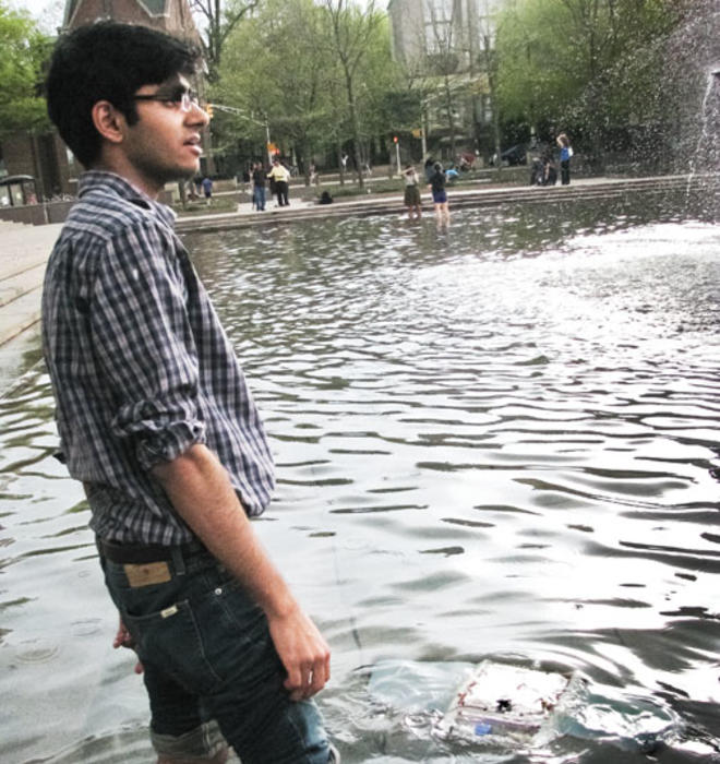 Javed tests his manta bot in the Woodrow Wilson School fountain.