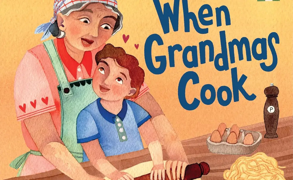 91WBD+kjLJL._SL1500_.jpg When Grandma Cooks book cover which features an illustration of a loving grandma and grandson standing together rolling out dough at a kitchen counter.