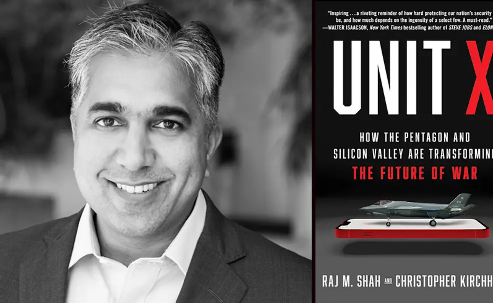 RajWithBook.jpg Raj Shah with the cover of his book, "Unit X," featuring an image of a fighter jet on top of a cell phone.