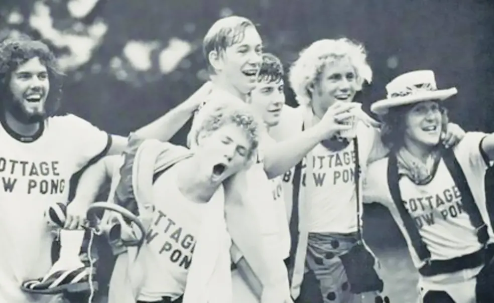 RG_Blow pong 2.jpg black and white photo of students clebrating and cheering during a blow pong tournament