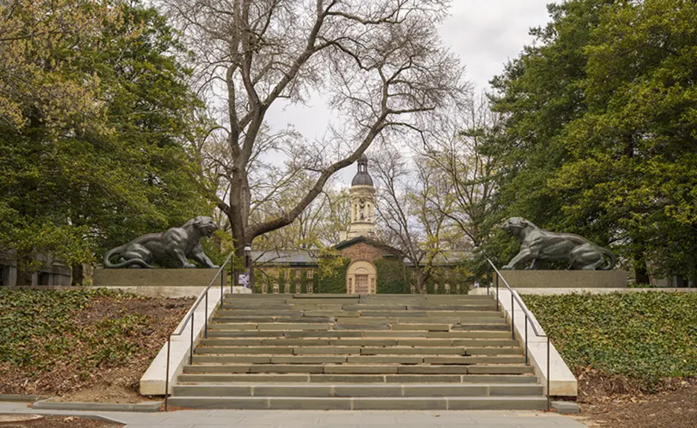 20250410_CampusBeautyApril_MR_042.jpg Nassau Hall is visible just over the top of stone steps.