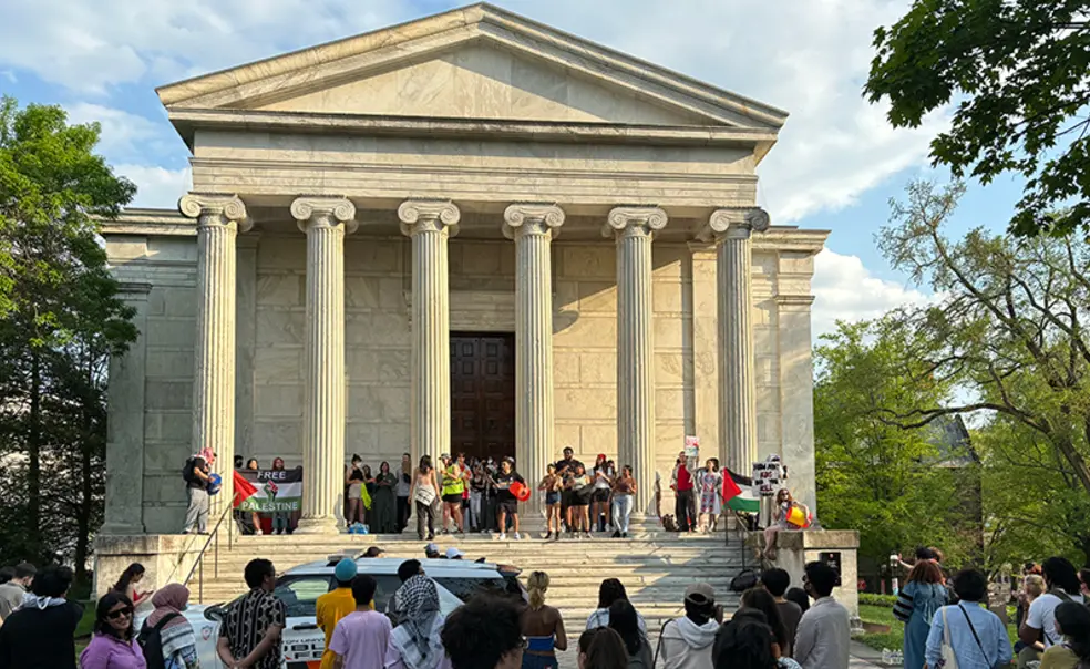 ClioHallProtest.jpg The front of Clio Hall, a classical-Greek-style columned building, with protesters standing on the steps.