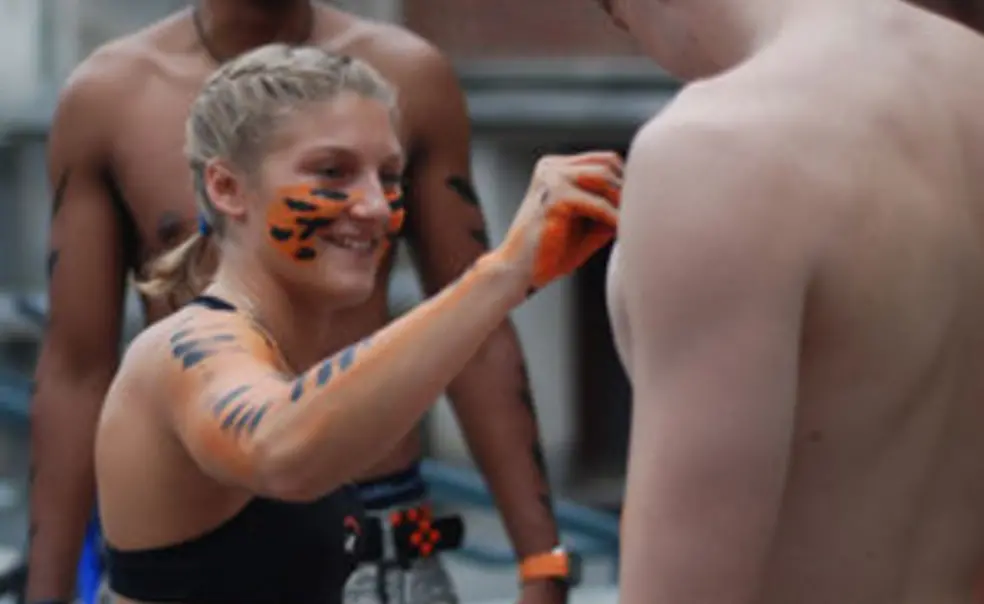 Primed and painted, students keep RAWR-ing at football games
