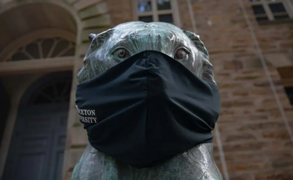 20200730_PrincetonTigers_Masks_DLA_011.jpg A bronze tiger statue in front of Nassau Hall wears a black face mask.