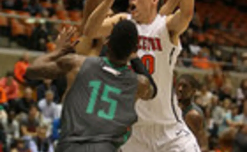 Men's Basketball Hangs With Harvard, Falls 82-76