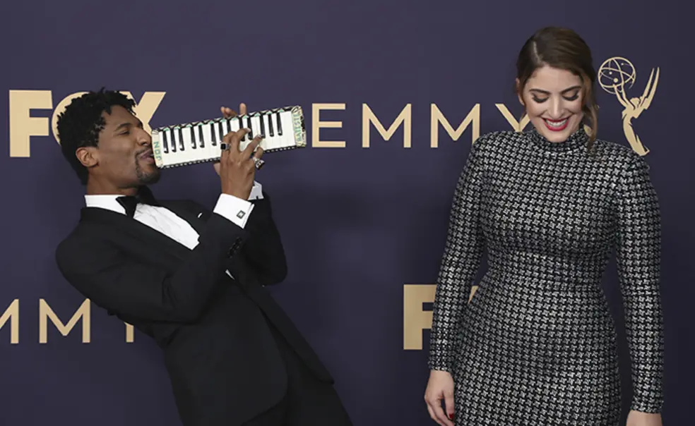 AP_SuleikaJaouad_AITN.jpg Suleika Jaouad ’10, right, and Jon Batiste arrive at the Emmy Awards on Sept. 22, 2019, in Los Angeles. Batiste plays a melodica while Jaouad laughs.