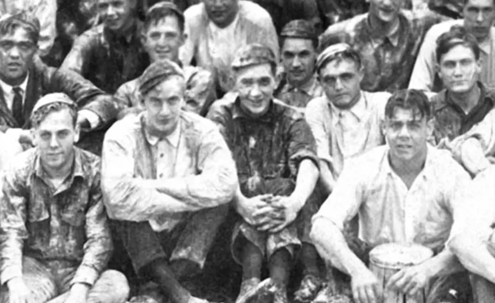 Ed_flourpic.jpg ’25 classmates in their “flour picture.”