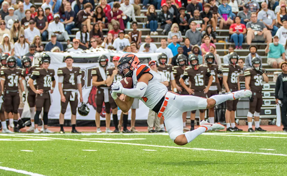 FootballPreview_#7 Classi - Diving Catch0.jpg Wide receiver Dylan Classi ’23 dives sideways to catch the ball.