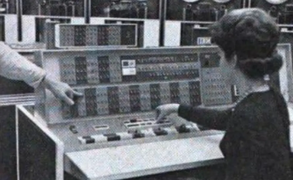 IBM7090.jpg A woman sits at the controls of the room-sized IBM 7090 at Princeton’s Computer Center, manually entering instructions. You can see the data storage tapes at the top of the screen.