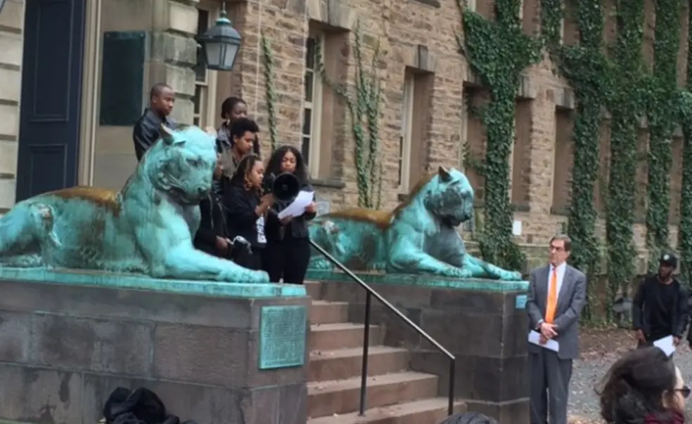 President Eisgruber â83, right, listens to the demands of the Black Justice League. (PAW/W. Raymond Ollwerther â71)