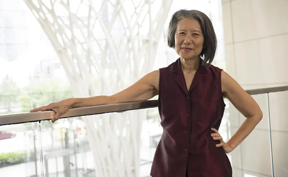 Krist_web.jpg Elizabeth Krist resting her arm on the top of a railing.