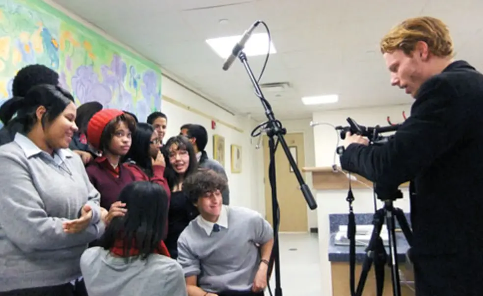 LIVE.AS_MIMA.jpg Geiseler with students at Cristo Rey High School in Harlem.