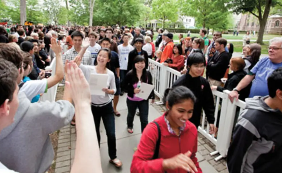 LIVE.NB_PreRade.jpg  Freshmen receive high-fives as they are greeted in the Pre-rade following Opening Exercises.