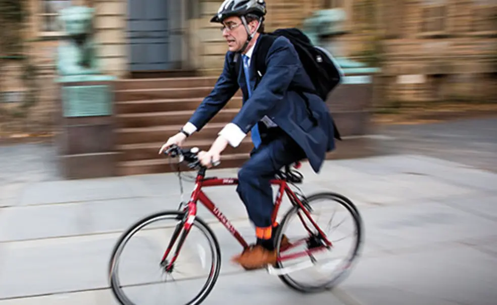 OTC-CLEbike.jpg President Eisgruber ’83 arrives at Nassau Hall.