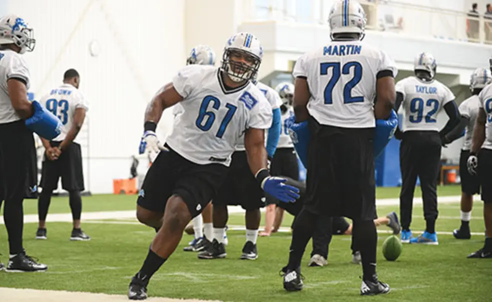 OTC-SP-ReidNFLnew.jpg Caraun Reid ’14 (61) runs a drill with the Detroit Lions.