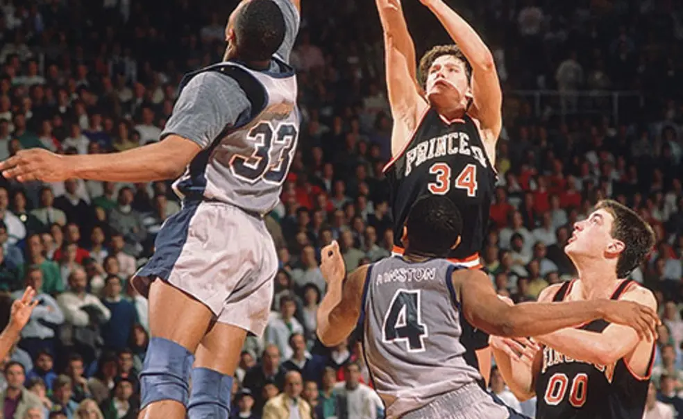 OTC-SP-georgetowngame_web.jpg Alonzo Mourning blocks a shot by Bob Scrabis ’89 in the 1989 NCAA Tournament. The Tigers’ Kit Mueller ’91 would get one more chance, but Mourning blocked that attempt as well.