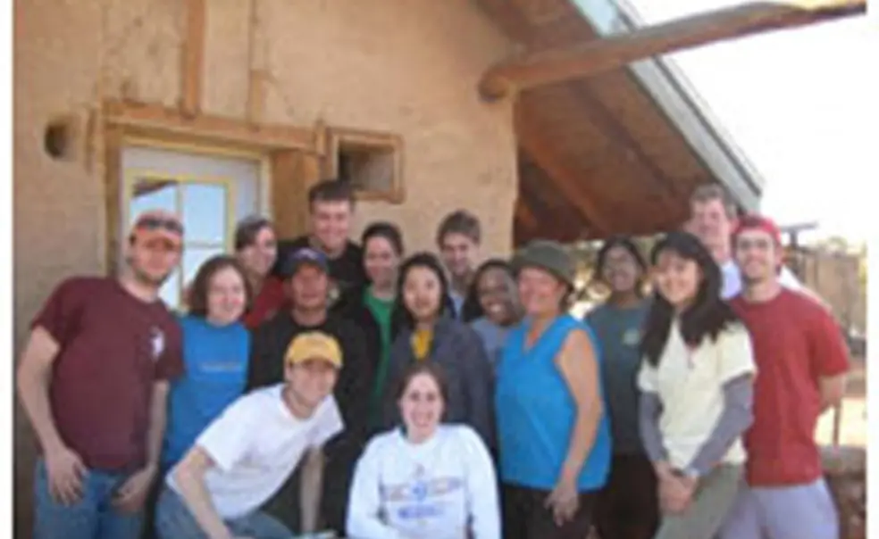 OTC_SB1.jpg Students who took part in the Breakout trip to Big Mountain, Arizona, a community on the Navajo Nation Native American reservation, stand in front of a home and straw bale that they worked on as part of their sustainable building project. From left are T