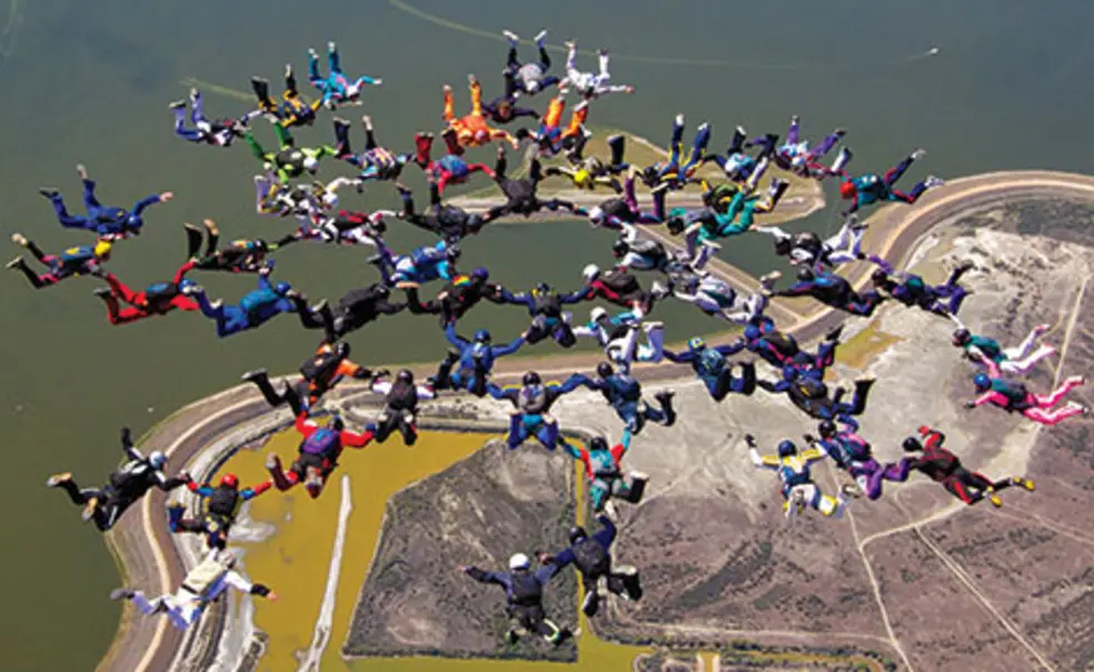 PRINCE-PursuitsSkyDivingNew.jpg George White ’57 is at 12 o’clock of the inner ring of eight, in black, in this 2012 world-record jump.