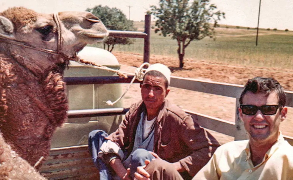 PRINCE_Randy-and-Camel.jpg Randolph Hobler ’68 hitchhiking in Libya