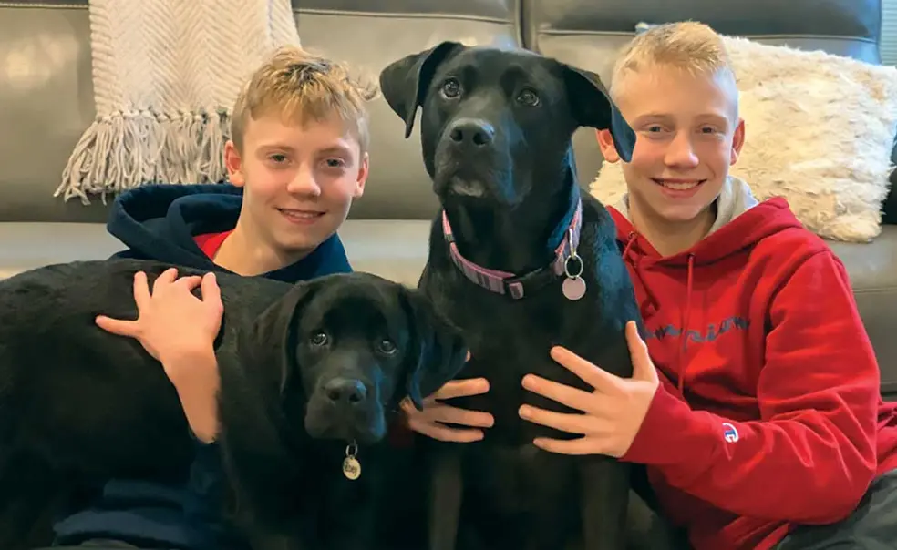 RESEARCH_Akeys-Dogs-and-Kids.jpg Professor Joshua Akey’s sons, Matthew, left, and Nicholas, right, with their dogs, Zoey, left, and Abby, right.