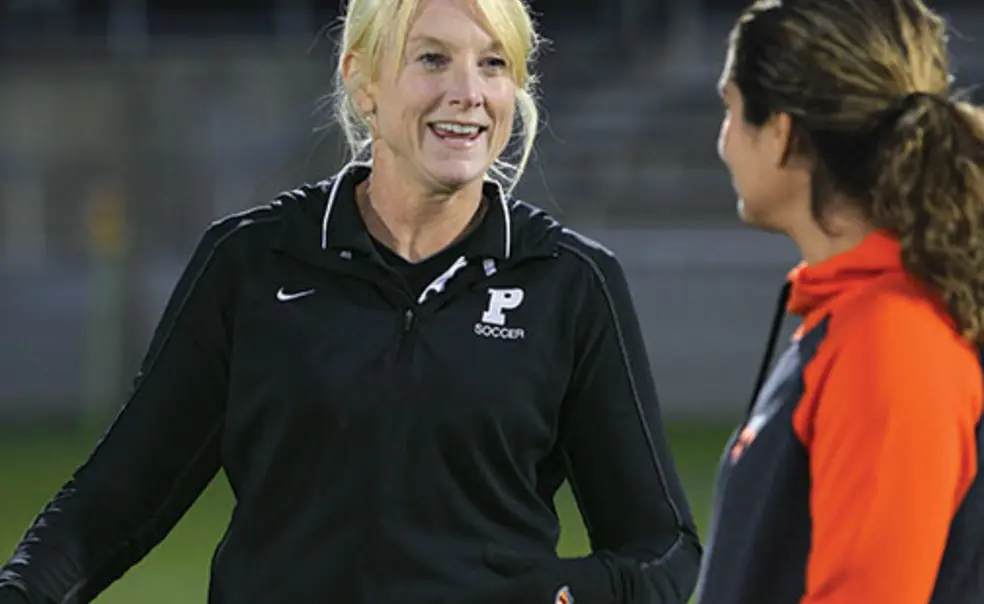 SP-Shackford055new.jpg Julie Shackford, left, talks with assistant coach Esmeralda Negron ’05 before the Tigers’ Oct. 11 win over Brown.