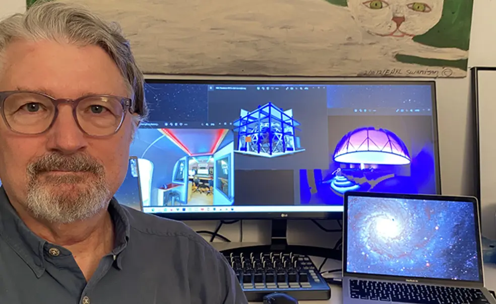 TOW_DavePentecost.jpg This is a photo of Dave Pentecost in front of the computer screens where he's working on the planetarium.