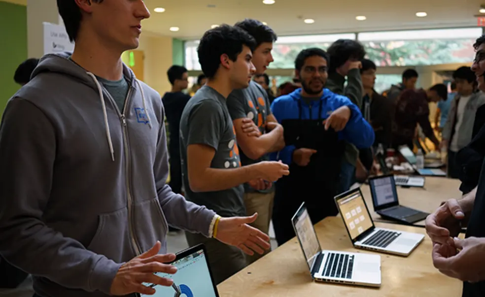 Collin Stedman â15, left, pitches HostShark at the HackPrinceton science fair. (Mary Hui â16/Picture Perfect)