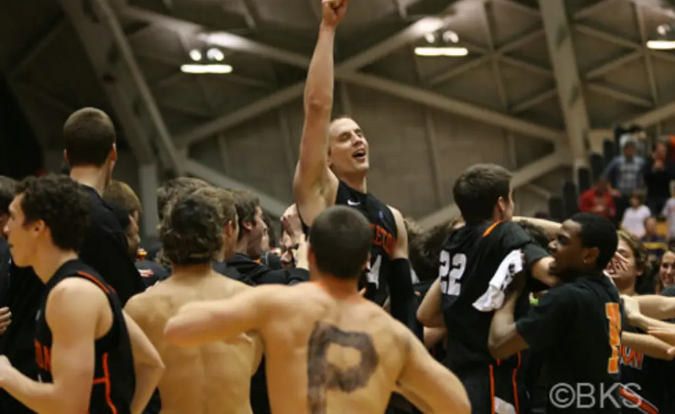 Men's basketball upsets Harvard, women's hoops dominates