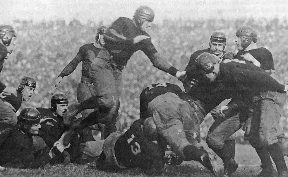 princeton-chicago.jpg This is a black-and-white photo of a football tackle from 1922.