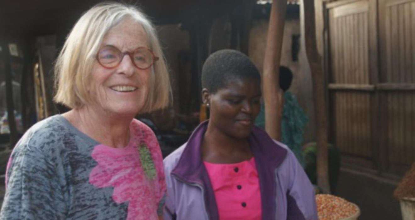 Susan Cotts Watkins *80, left, in Malawi with young Malawian girl.