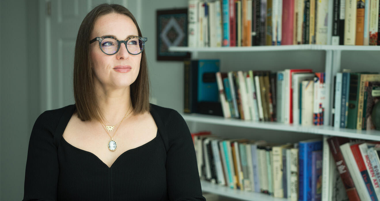 Julia Iofee stands in her library