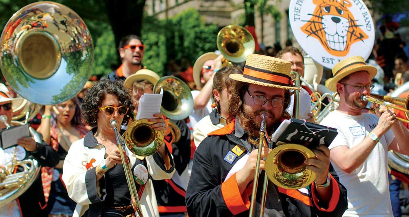 The brass, from left: Christina Farah ’09, Justin Coon ’22, and Riley Fitzgerald ’16