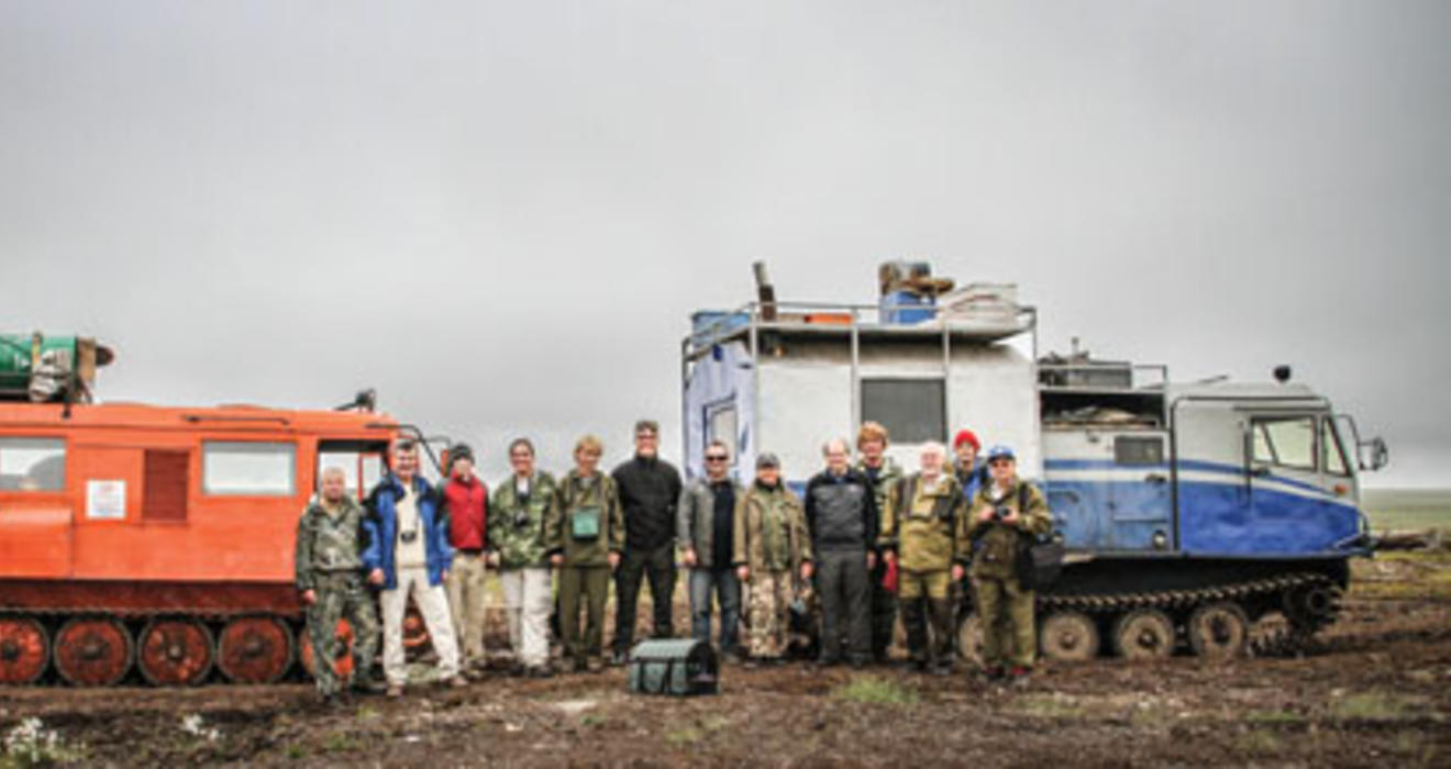 Members of the July 2011 expedition to Russia stand in front of trucks fitted with tank treads to crawl across the permafrost; from left, Bogdan Makovskii, Glenn MacPherson *81, Will Steinhardt, Chris Andronicos *99, Marina Yudovskaya, Luca Bindi, Victor