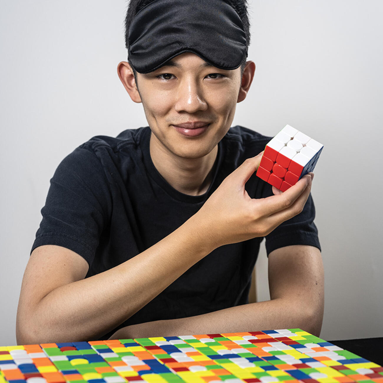 Andrew Tao &rsquo;23 shows off the first of many Rubik's Cubes he will solve.