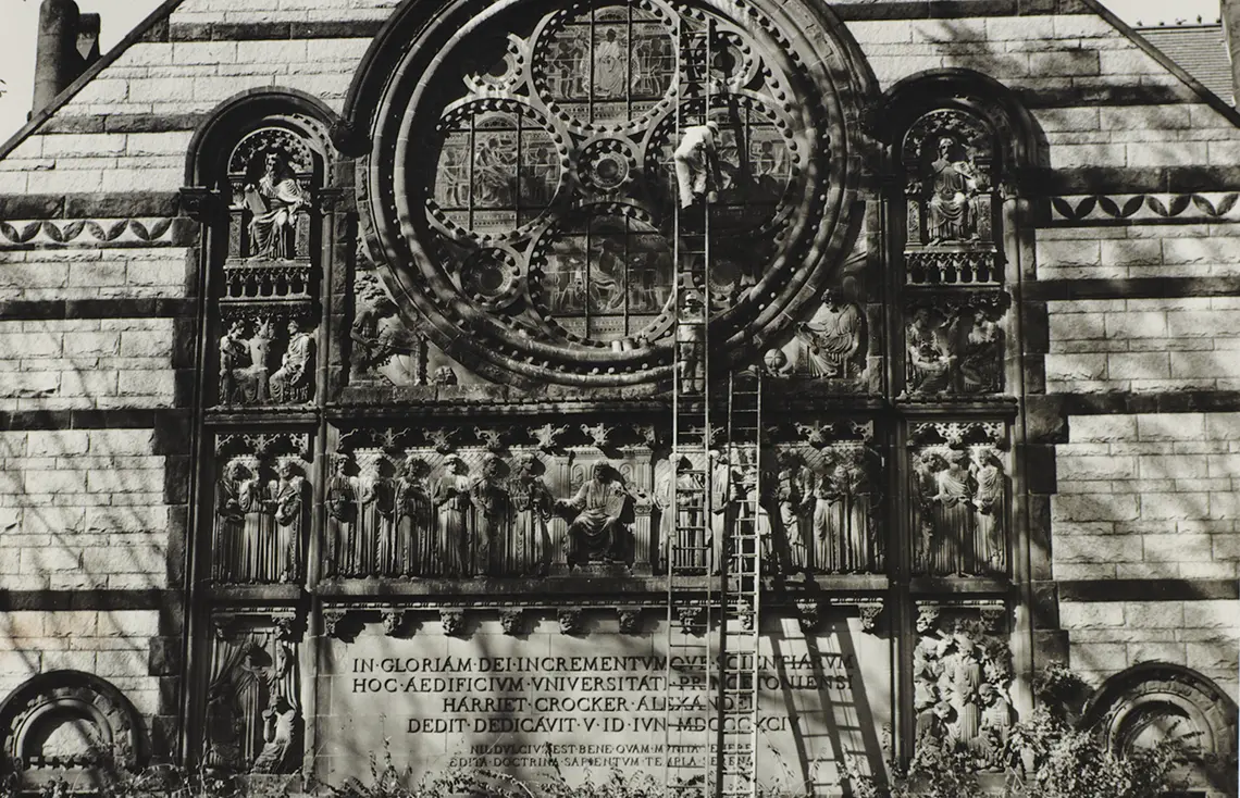 OTC_Menzies_Copy-of-3.jpg Sepia-toned photo of ladders leaning up against a stained-glass window.
